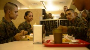 PFC Naveh K. Nacion, left, his twin sister, PFC Kaia M. Nacion, and their brother, Nicholas K. Nacion eat during a warriors breakfast after the Crucible finished, Oct. 29, 2016. (Photo by Lance Cpl. Carlin Warren)
